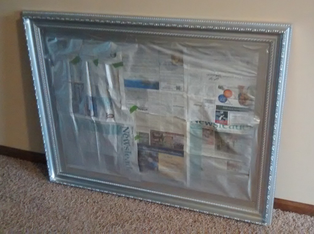 Spray paint a large picture frame or mirror without taking apart. Just use painters tape along the edges and newspaper to cover & protect from overspray.