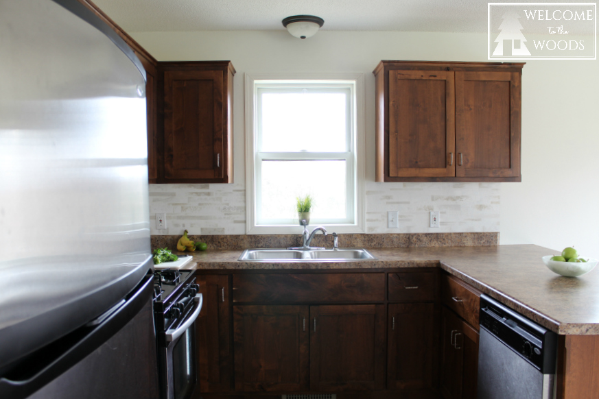 Painting your walls white shows off your wood cabinetry and makes your small kitchen look larger!