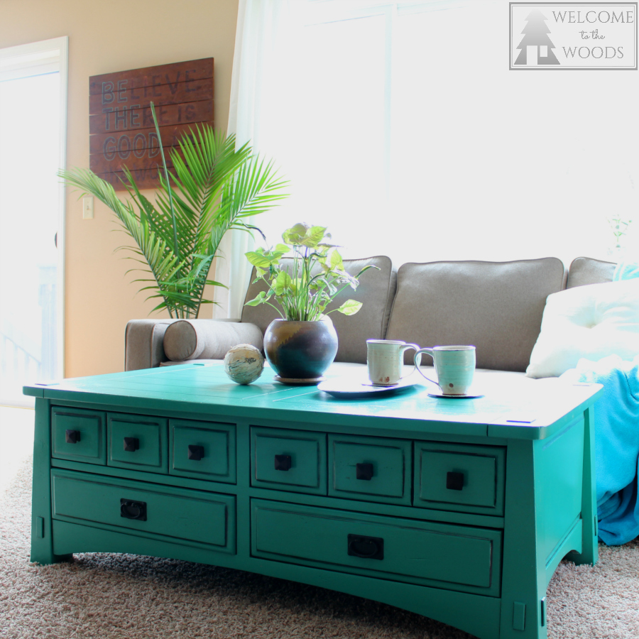 Bright teal turquoise coffee table provides a funky and modern focal point to this modern contemporary living room design.