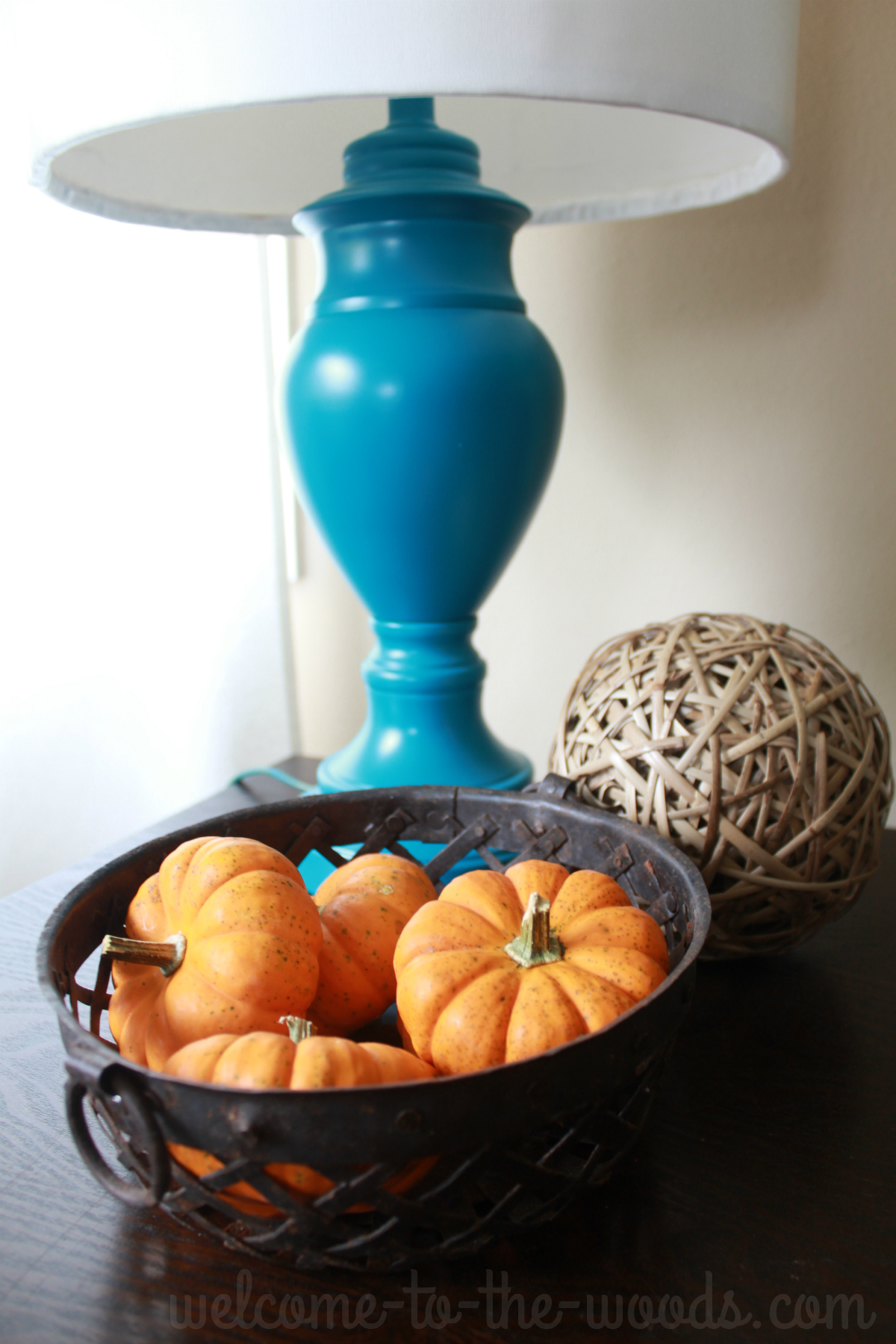 Decorate with mini pumpkins for autumn. Just throw some in a basket!