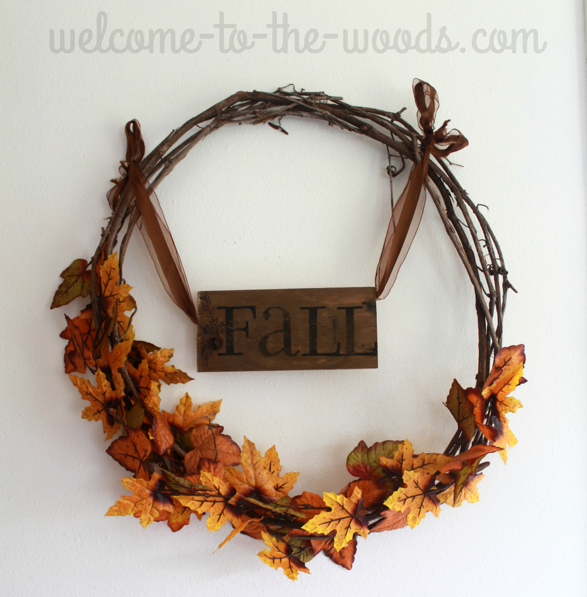 Pallet wood fall sign hung on a leaf grapevine wreath. Decor ideas 2016.