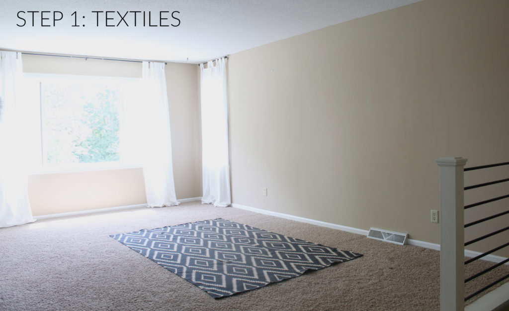 Step 1 to designing a room, start by choosing basic textiles. Curtains, rugs, or fabric accented architectural features bring softness into the space.