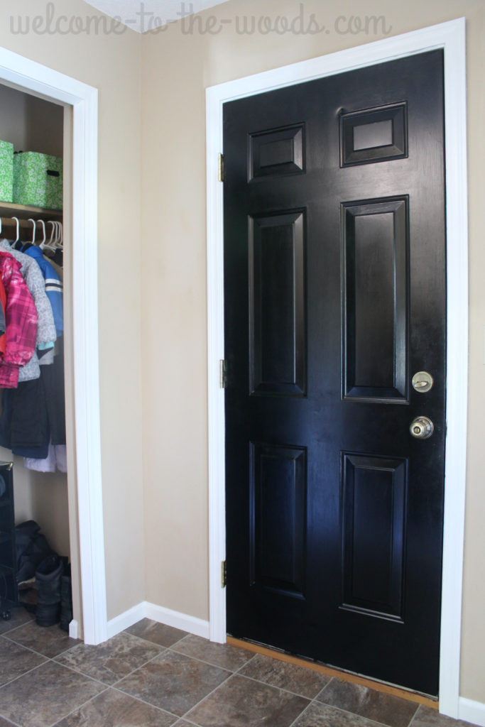 Paint the door to your garage black to hide the grime and dirt that builds up on it.
