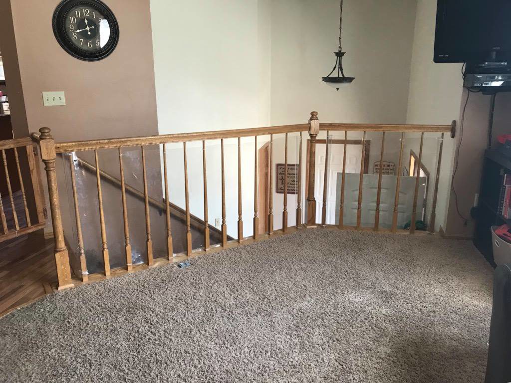 Stair baluster with 6 inch wide spindles is unsafe and not in accordance with building code.