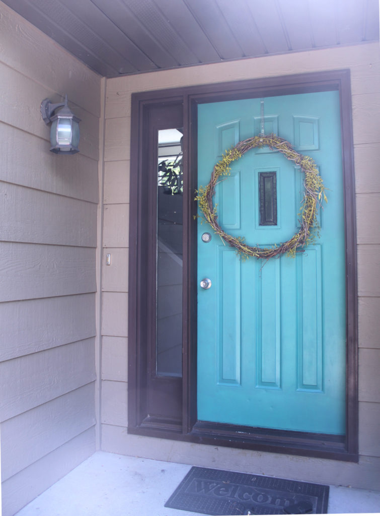 Bright teal front door summer update to boost curb appeal