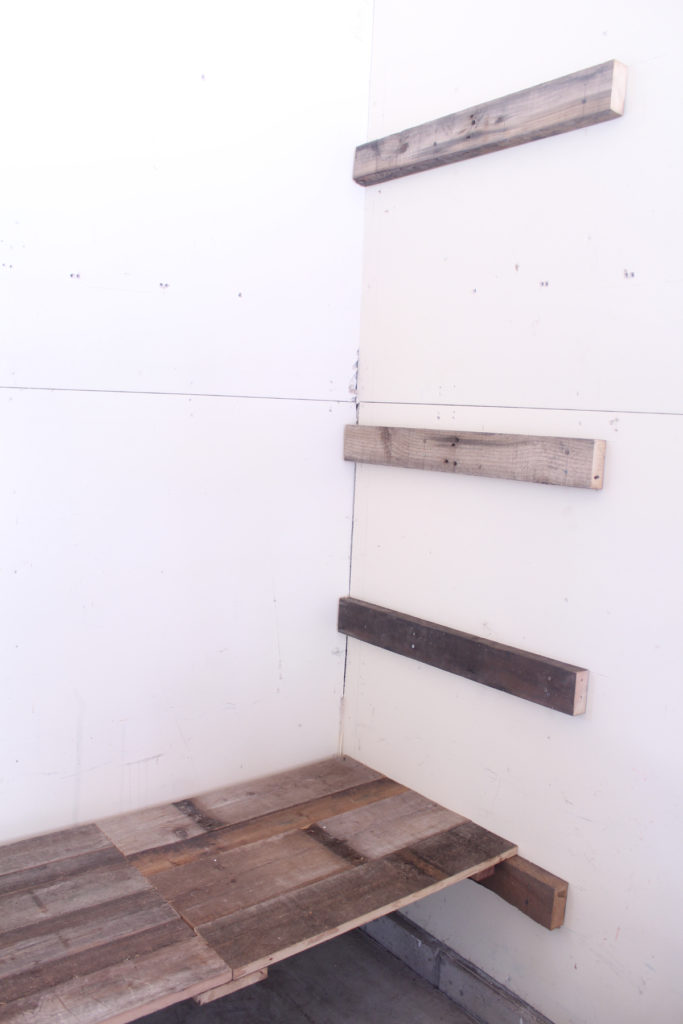Plans for simple and low-cost DIY garage shelving using reclaimed wood
