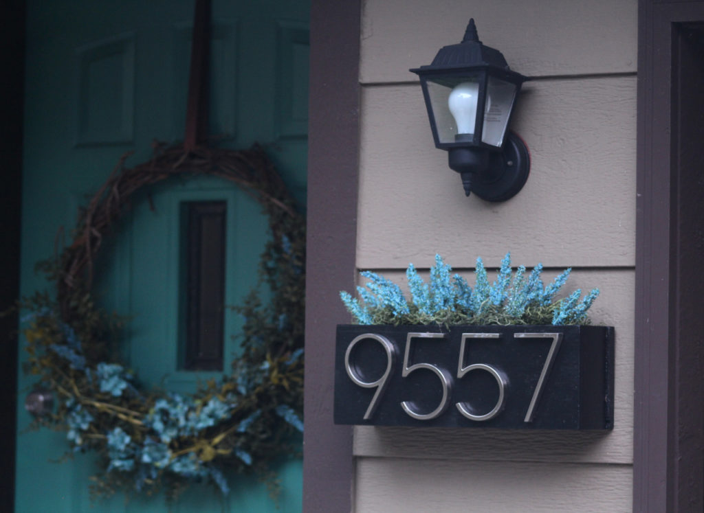 Make a planter box to display house numbers in style. Switch out decor for the different seasons