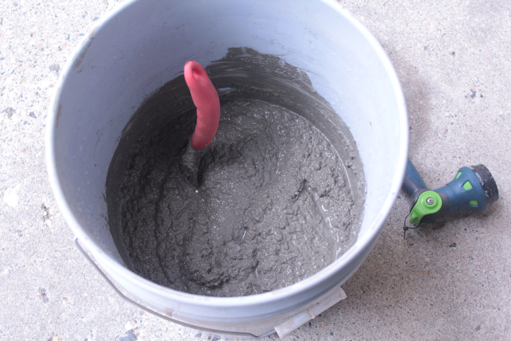 Mixing concrete to the consistency of peanut butter