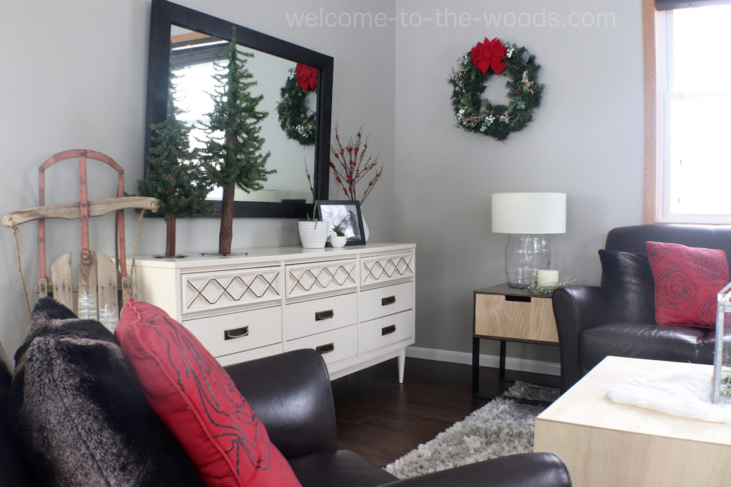 Cozy, modern living room decor for Christmas pops of red, handmade wreath, vintage sled, and more!