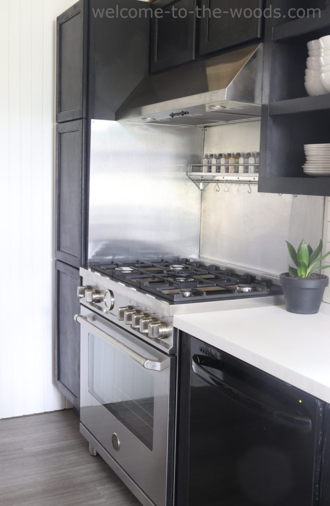Bertazzoni Master Series Range stainless steel with vent hood and Ancona backsplash. Kitchen makeover modern industrial kitchen black and white