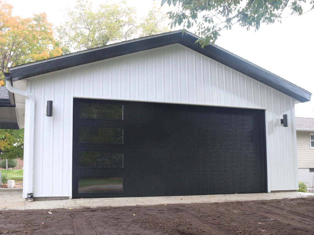 Wayne Dalton modern black garage door with four vertical windows