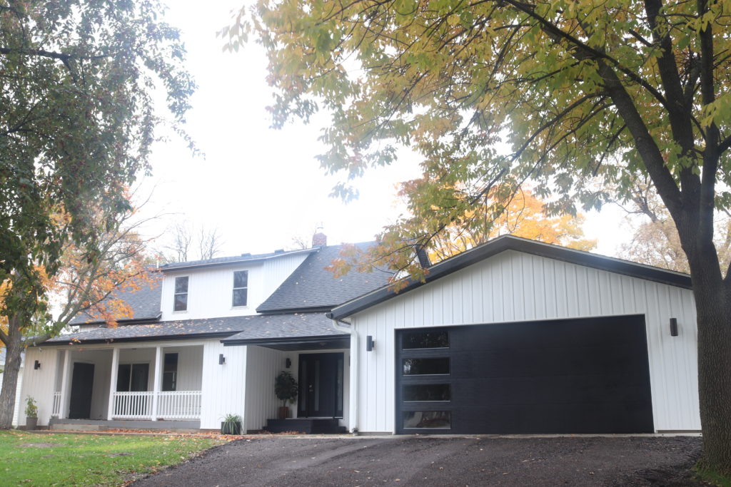 Exterior Home Makeover Farmhouse, White Modern Farmhouse With Black Garage Doors