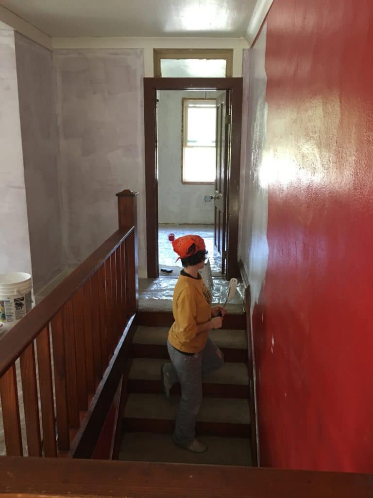 Painting over red walls on the stairway
