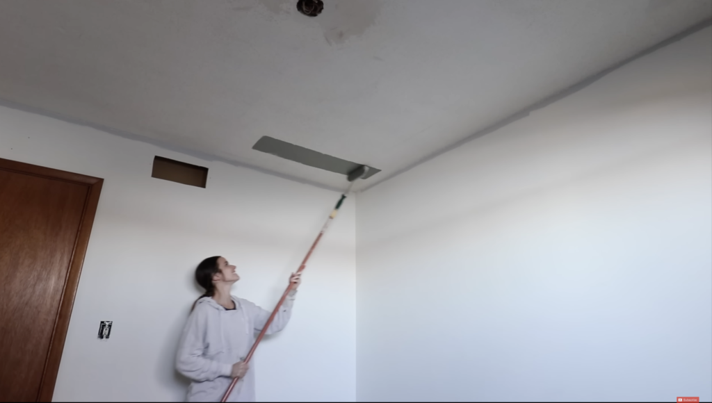 painting the ceiling green, a key part to the complete office transformation