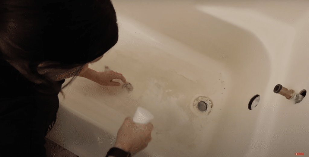 cleaning the mildewy tub